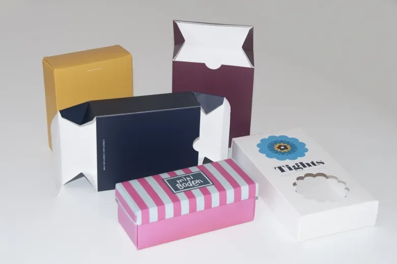 Several custom boxes in yellow, navy, burgundy and pink stripes