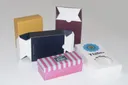 Several custom boxes in yellow, navy, burgundy and pink stripes