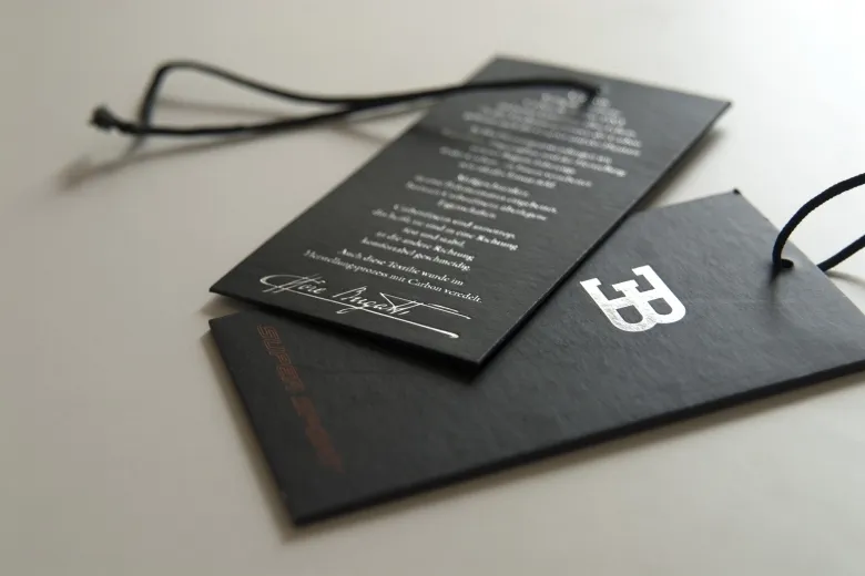 Black board hang tags with white print and black string