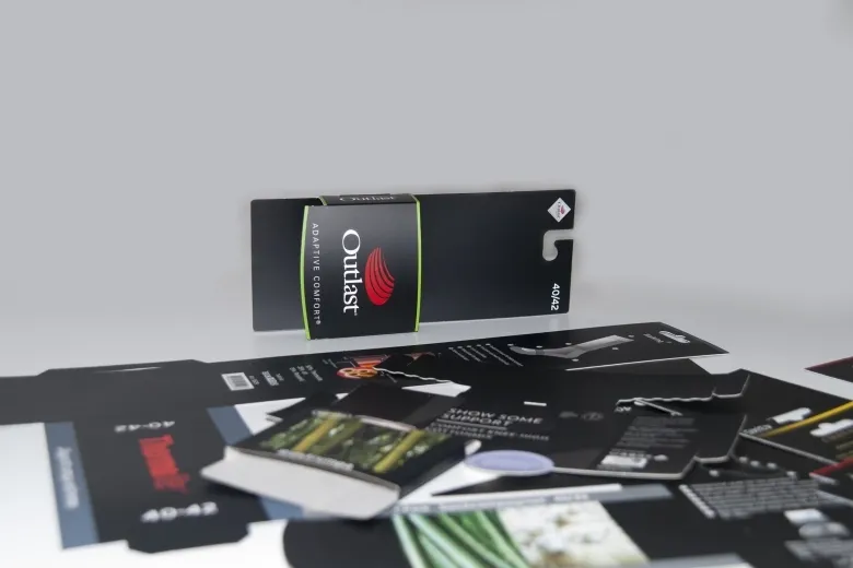 Black cardboard counter display with die-cut parts around it